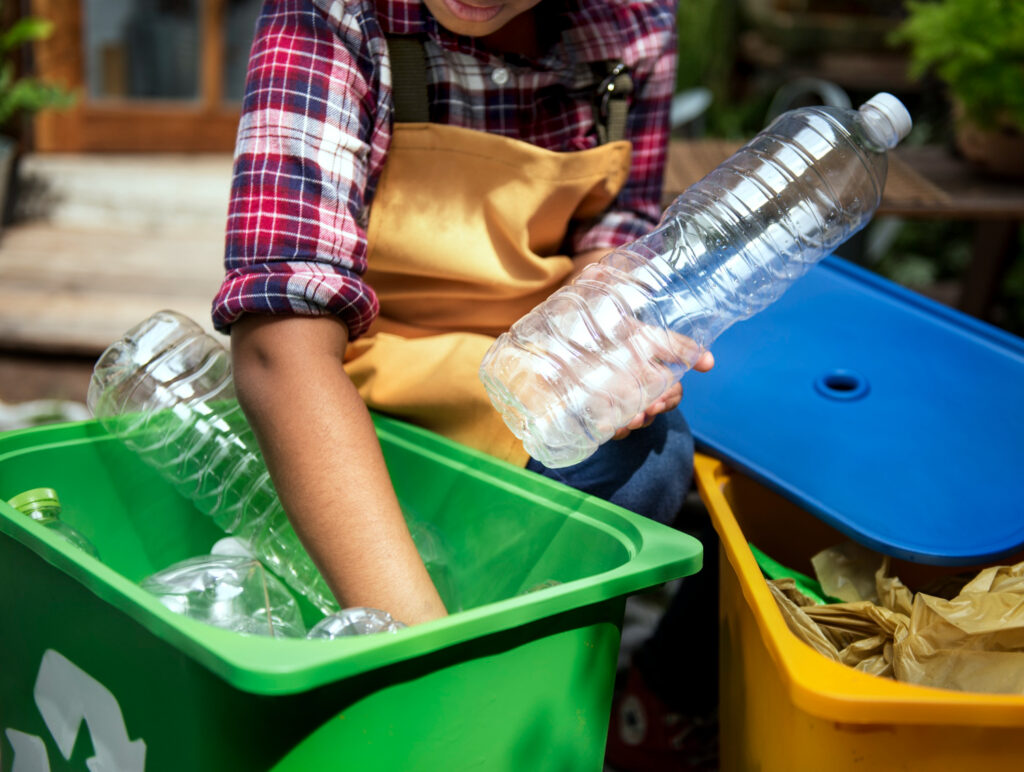 closeup hands separating plastic bottles