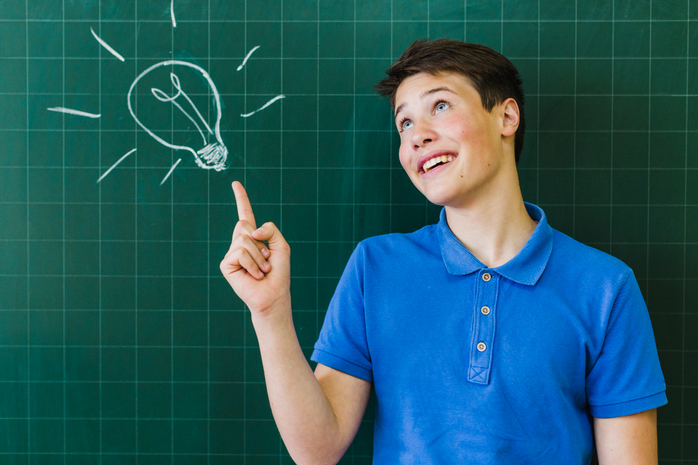 boy pointing blackboard