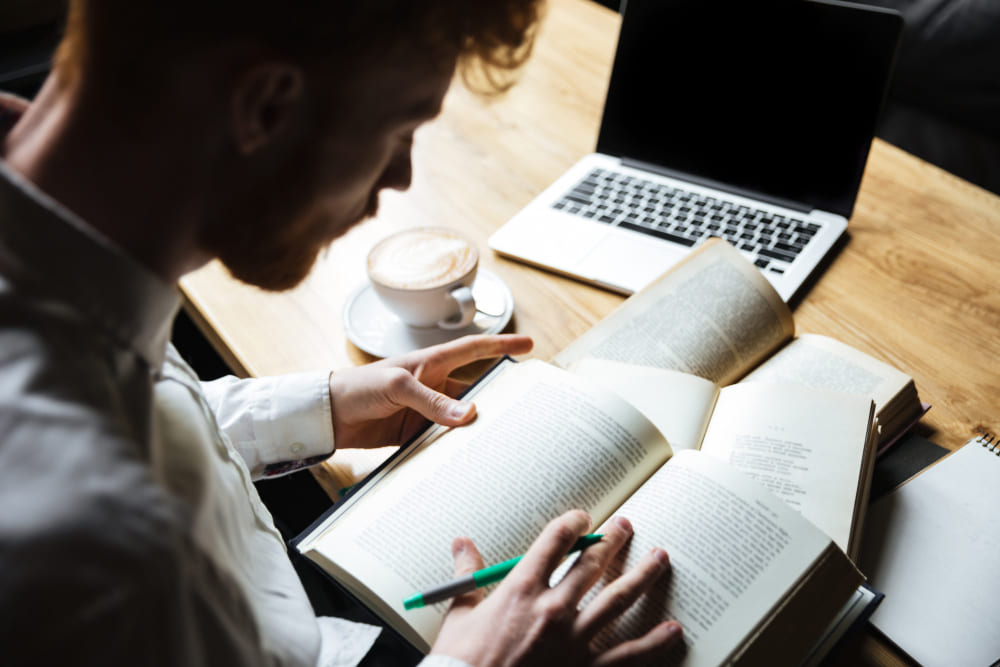 top view young redhead male student preparing university exam 1